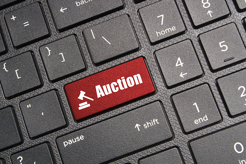 Bidding in online auctions with the push of a button